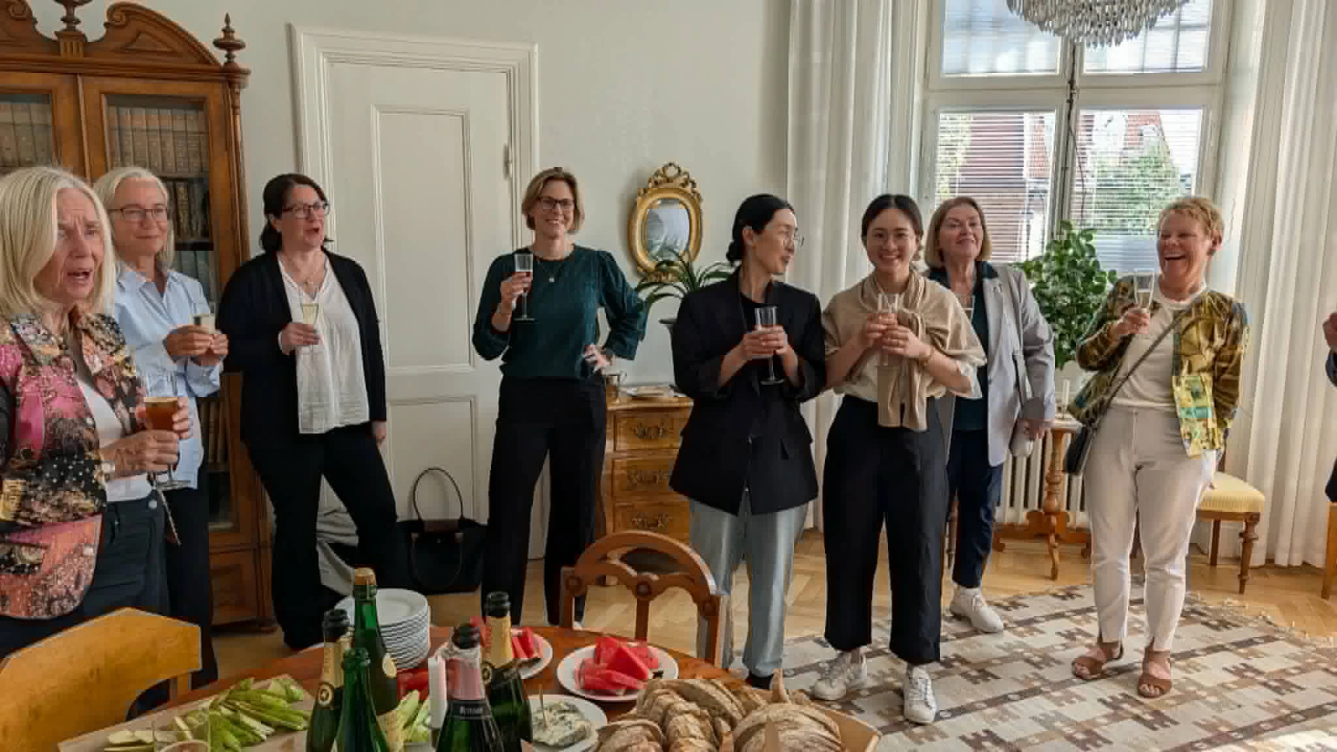 Participants raising their glasses during the onsite networking with buffet following the First International NPC Workshop 2026